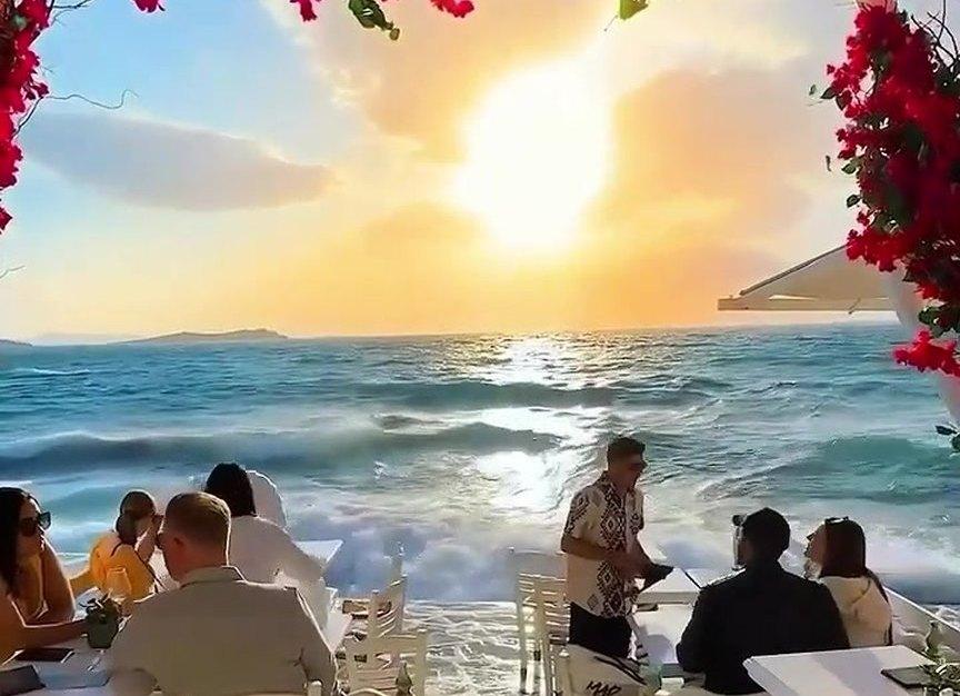 Seaside resort terrace at golden hour